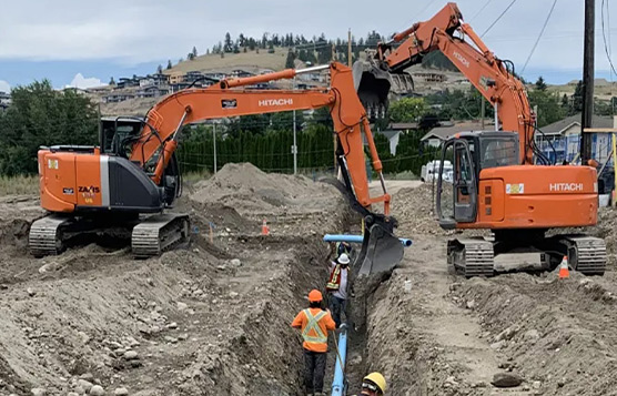Excavators and crew on a RockHard civil trench site