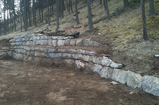 Stepped natural stone wall