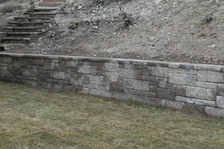 Cultured stone retaining wall